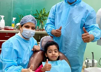 Child patient in the dental chair with the Abhirachna Dental team